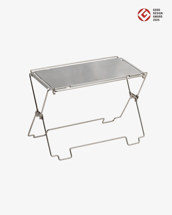 Foldable metal table on a white background with 'Good Design Award 2023' logo.